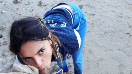 Very cute amateur girlfriend sucking boyfriends dick on the beach on their vacation