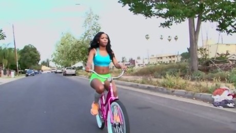 Ebony chick Toni Marie is riding her bike and sitting on dude's face