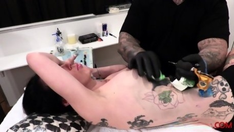 Marie Bossette gets a rose tattooed on her rib