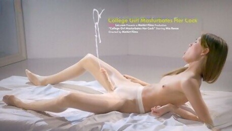 Cute college girl jerks her strapless dick until it squirts
