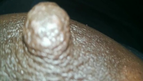 erect ebony nipples close-up